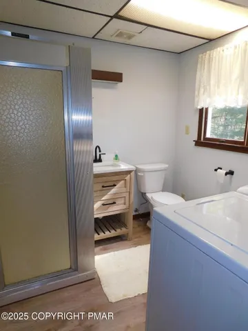 a room with a sink and a mirror