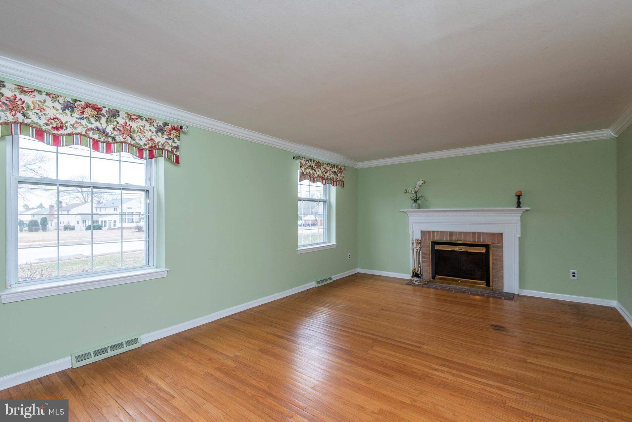 654 Barry Drive Springfield, PA 19064 - Photo 6 of 26 Living room with wood burning fireplace