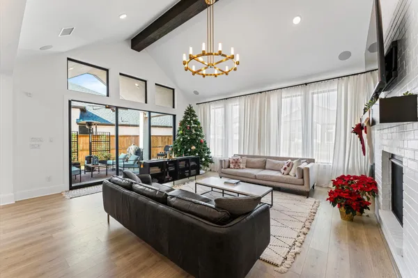a living room with furniture fireplace and flat screen tv