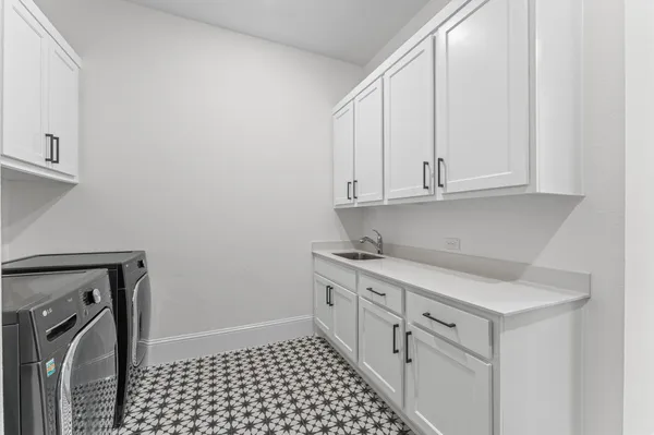 a kitchen with a sink and cabinets