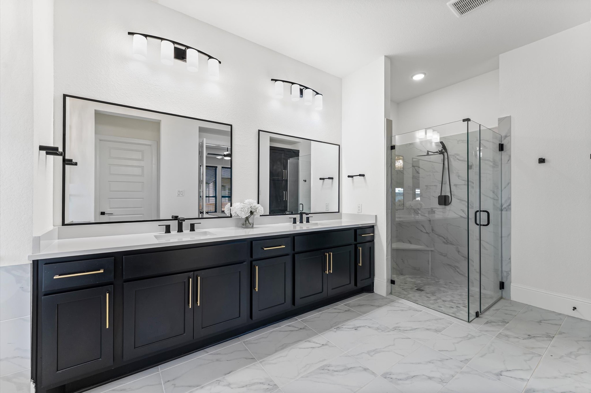 15470 Ringbill Way Magnolia, TX 77354 - Photo 23 of 50 a bathroom with a double vanity sink mirror and double