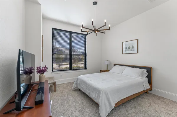 a bedroom with a bed furniture and a window