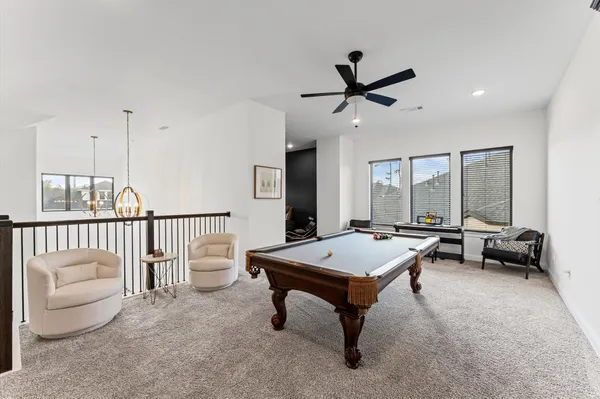 a room with furniture and pool table