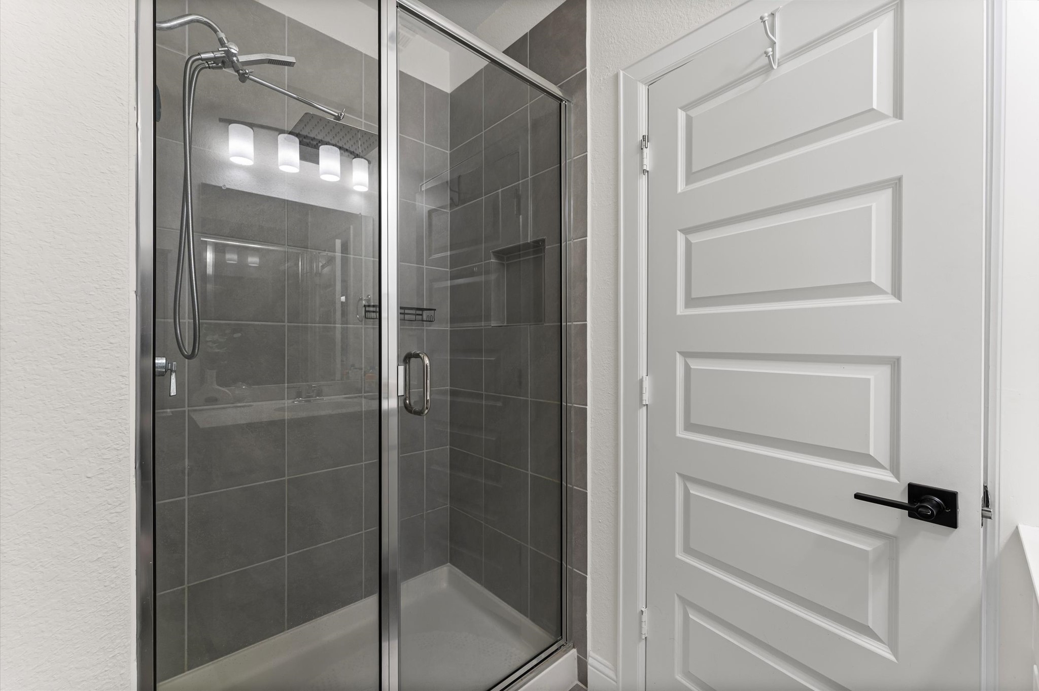 15470 Ringbill Way Magnolia, TX 77354 - Photo 36 of 50 a bathroom with a glass shower door