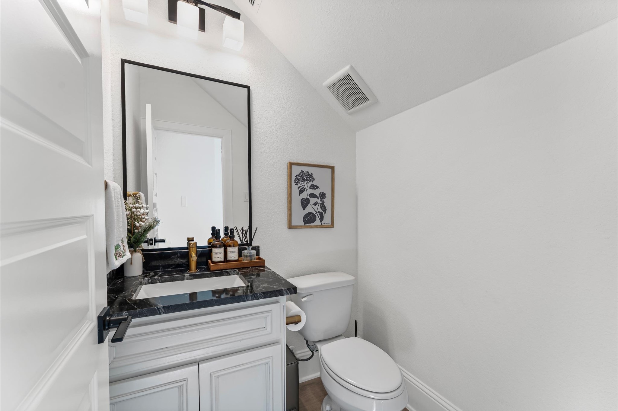 15470 Ringbill Way Magnolia, TX 77354 - Photo 6 of 50 a bathroom with a toilet a sink and mirror