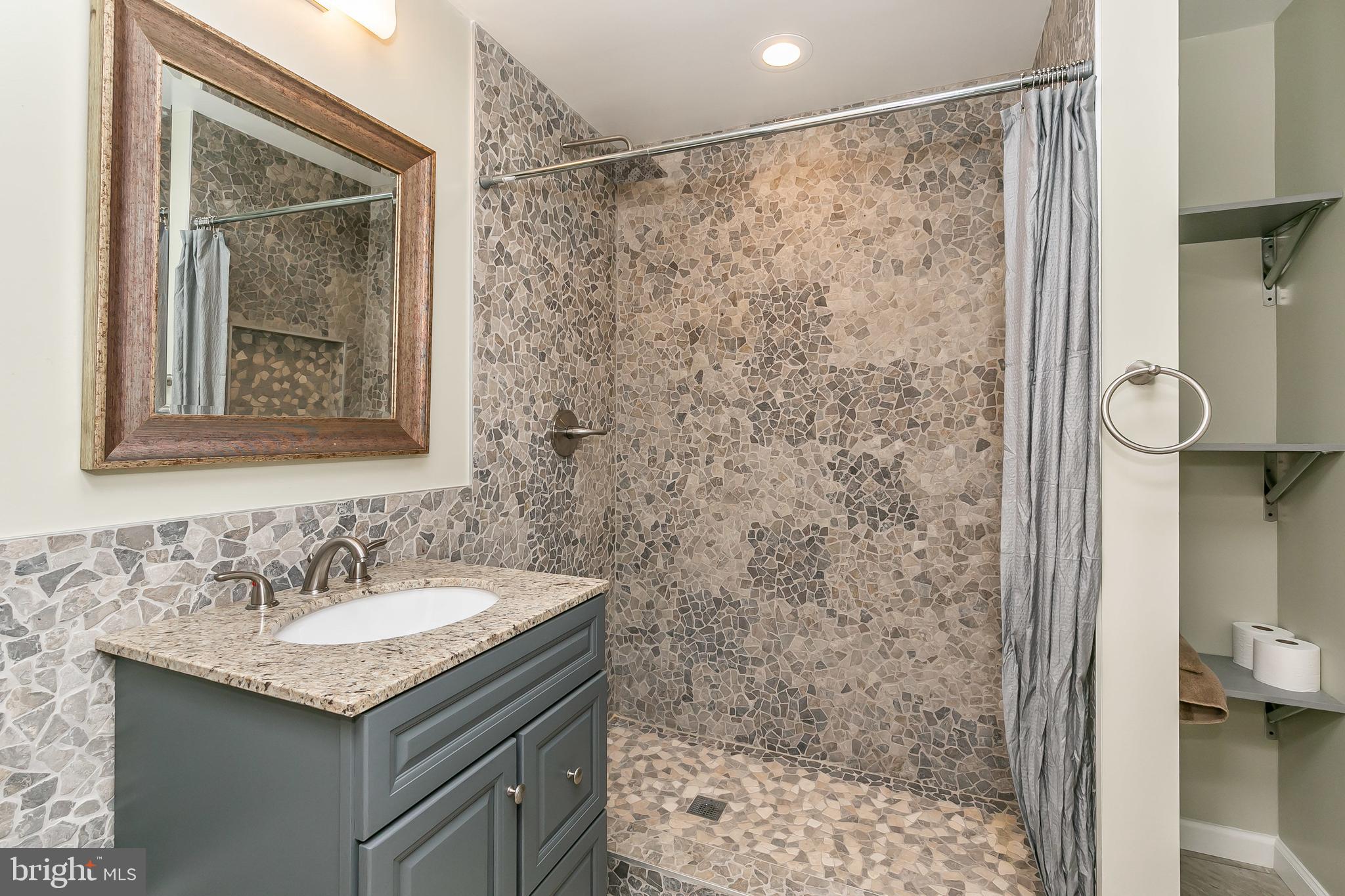 1830 Hillside Road Stevenson, MD 21153 - Photo 32 of 46 LOWER LEVEL FULL BATHROOM WITH AMAZING STONE DETAI