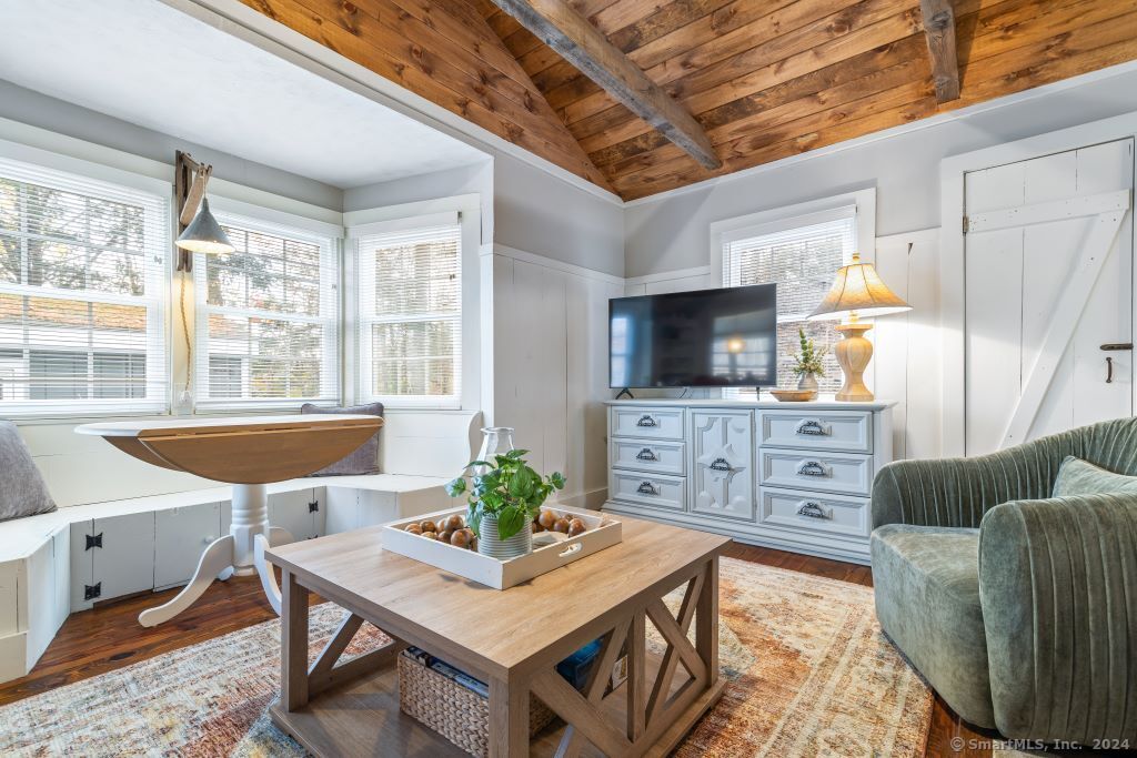 5 Old Clark Hill Road East Hampton, CT 06424 - Photo 12 of 20 a living room with furniture a flat screen tv and a dining table