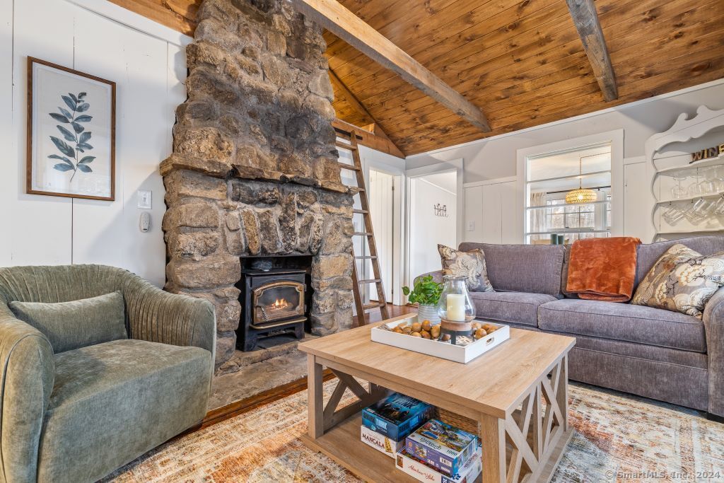 5 Old Clark Hill Road East Hampton, CT 06424 - Photo 7 of 20 a living room with furniture and a fireplace
