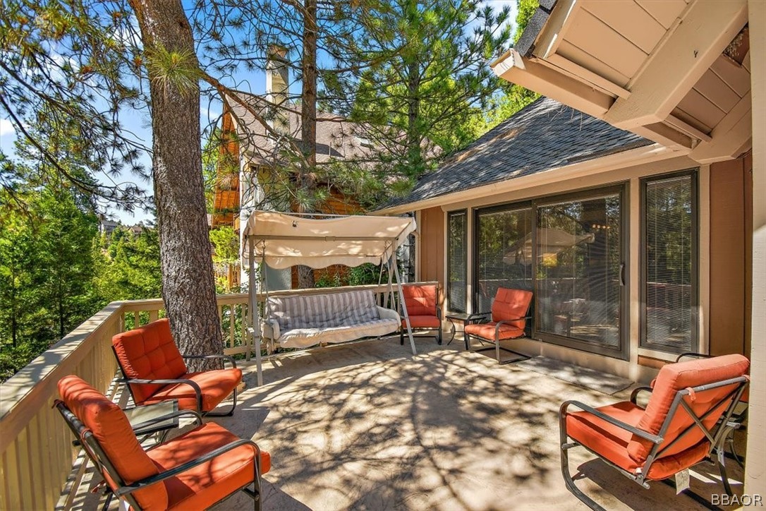 641 Golf Course Road Lake Arrowhead, CA 92352 - Photo 19 of 46 a backyard of a house with barbeque oven table and chairs