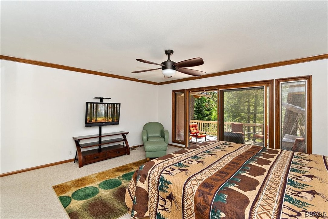 641 Golf Course Road Lake Arrowhead, CA 92352 - Photo 25 of 46 a bedroom with a bed and a large window