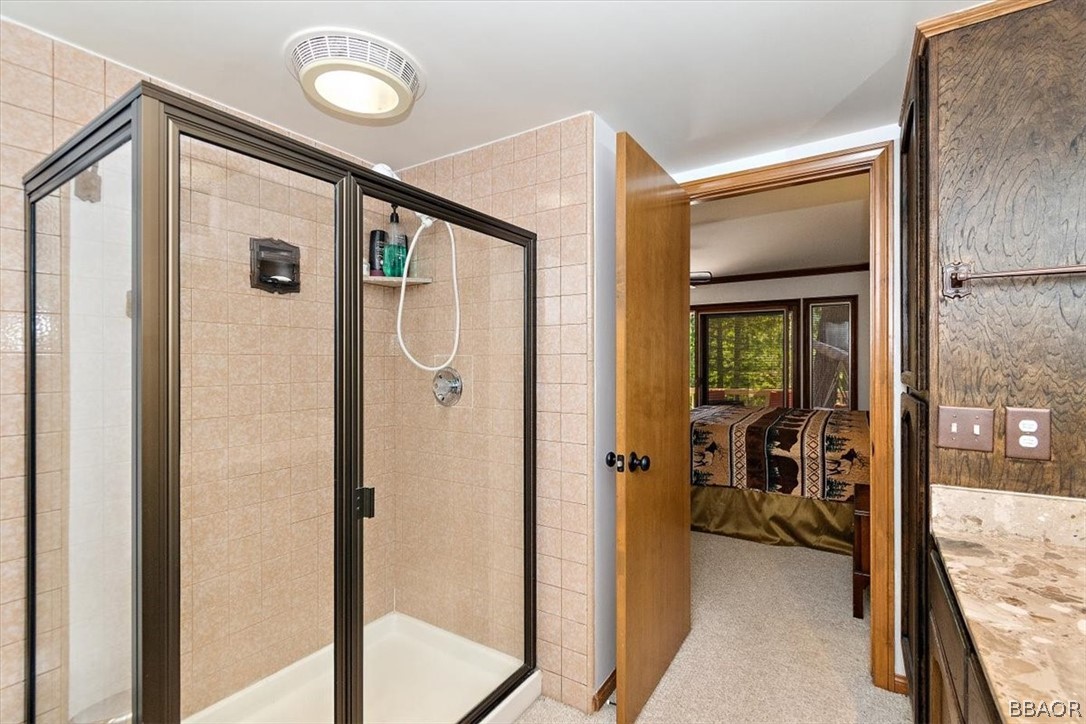 641 Golf Course Road Lake Arrowhead, CA 92352 - Photo 27 of 46 a view of a hallway with bathroom and mirror