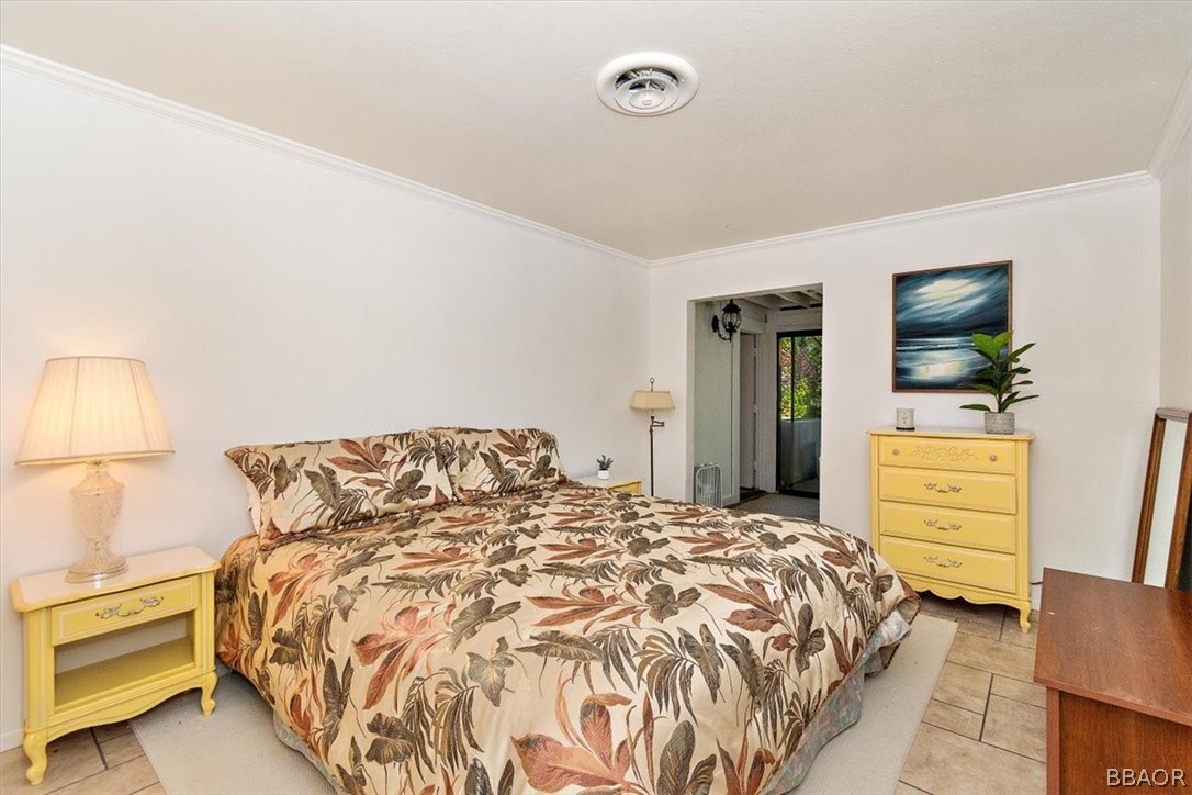 641 Golf Course Road Lake Arrowhead, CA 92352 - Photo 31 of 46 a bedroom with a bed and a flat screen tv