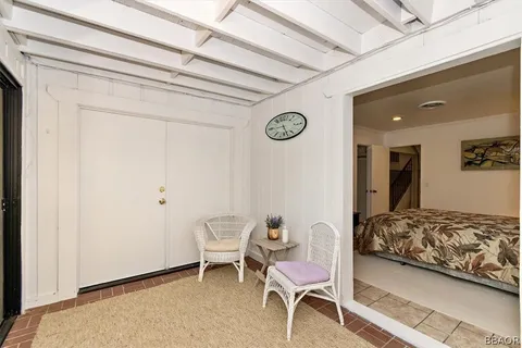 a bedroom with a bed and a chair