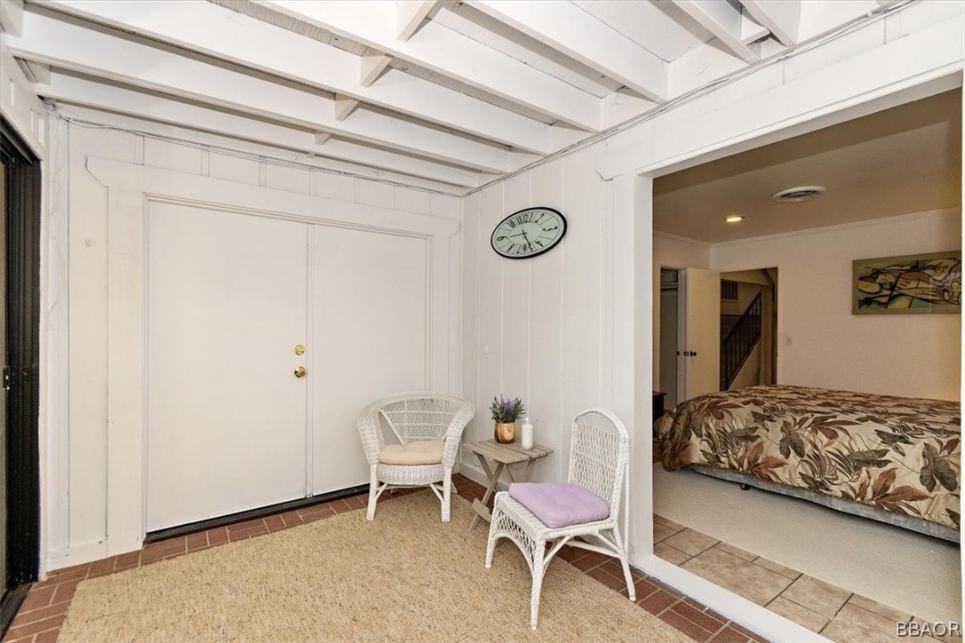 641 Golf Course Road Lake Arrowhead, CA 92352 - Photo 32 of 46 a bedroom with a bed and a chair