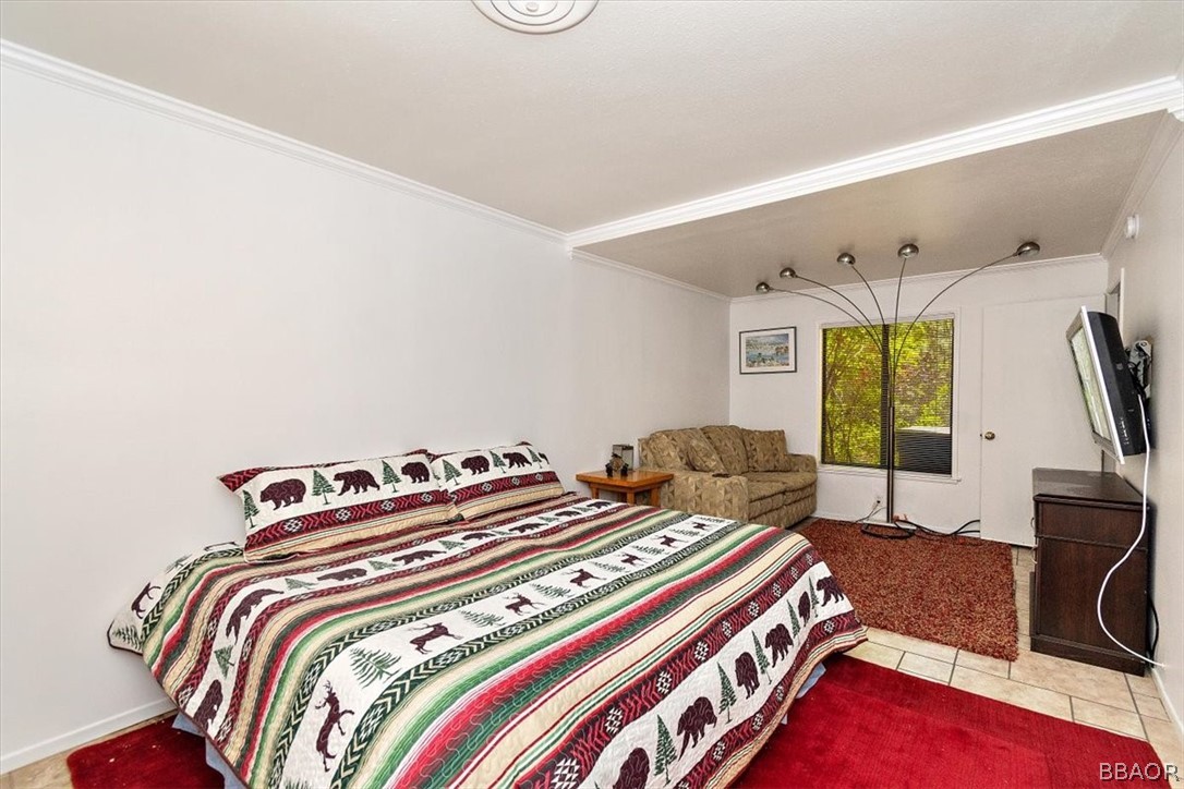 641 Golf Course Road Lake Arrowhead, CA 92352 - Photo 35 of 46 a bedroom with bed and a window