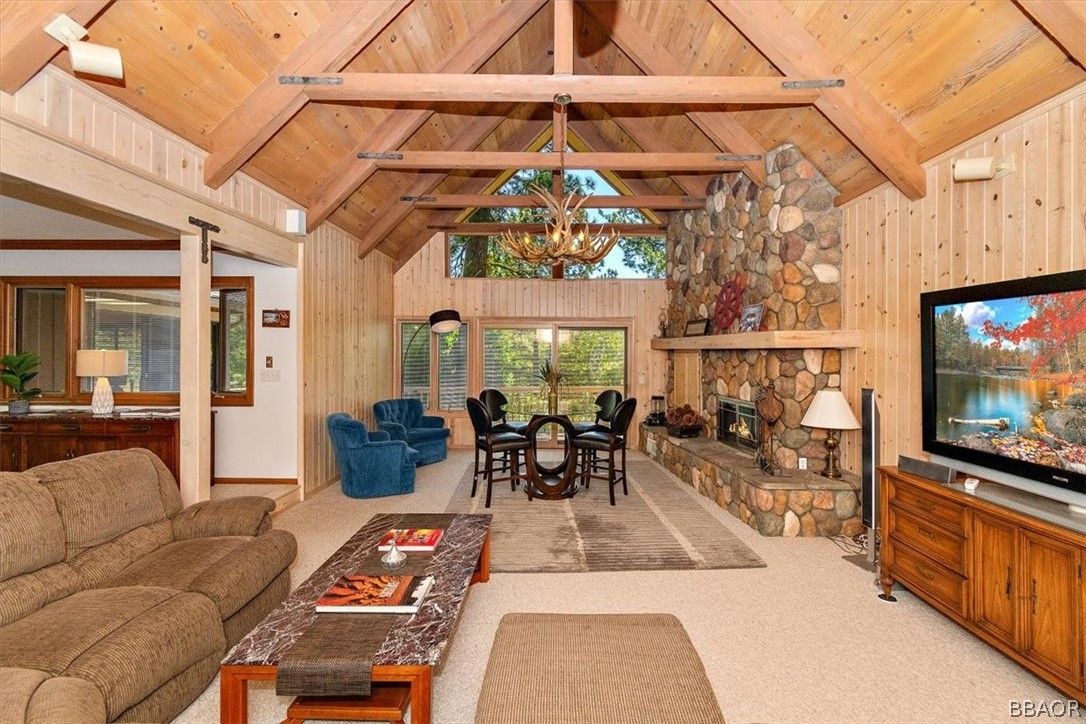 641 Golf Course Road Lake Arrowhead, CA 92352 - Photo 7 of 46 a living room with furniture and a flat screen tv