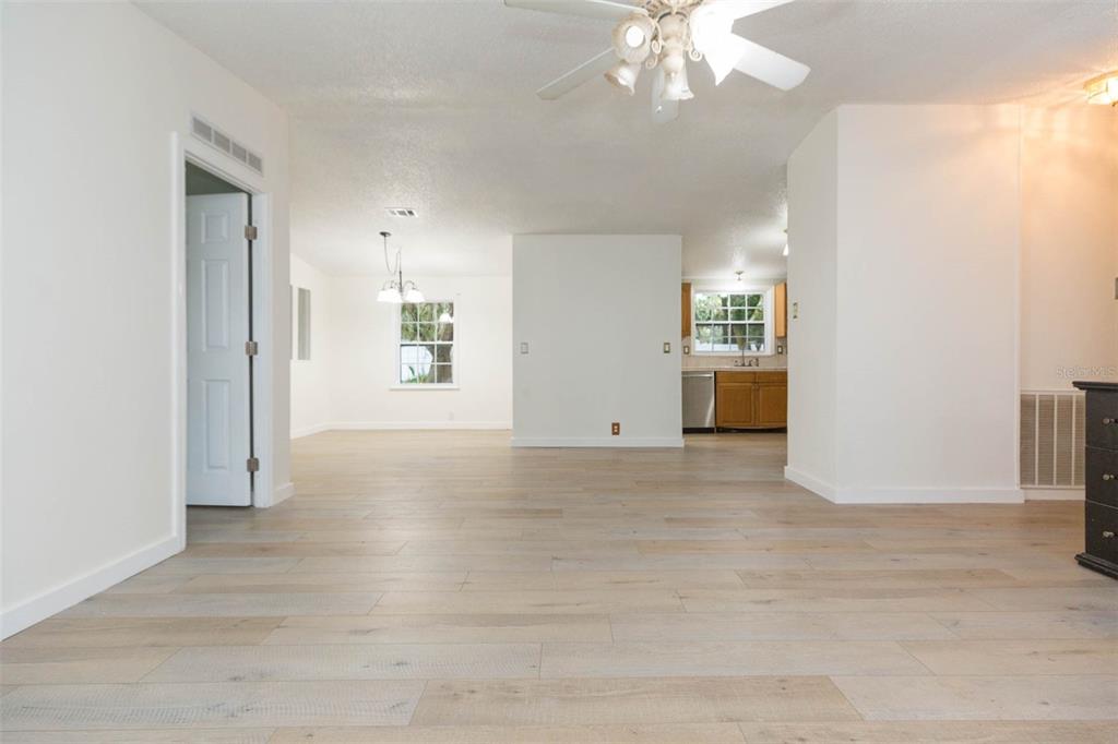 12628 Fort King Road Dade City, FL 33525 - Photo 4 of 59 an empty room with windows and entrance