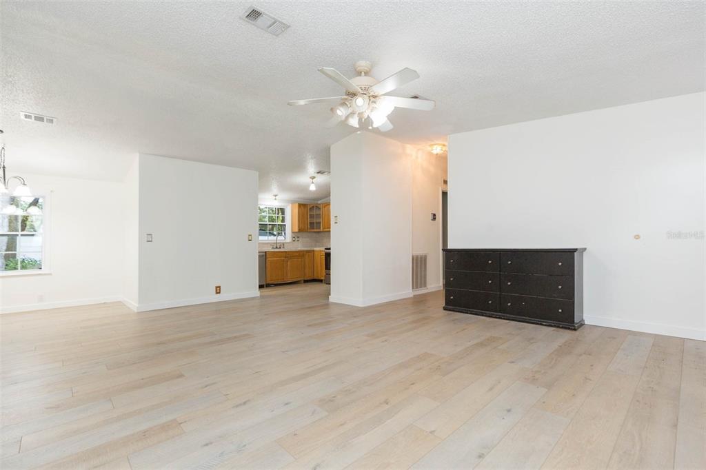 12628 Fort King Road Dade City, FL 33525 - Photo 5 of 59 a view of a kitchen with a sink and a chandelier fan
