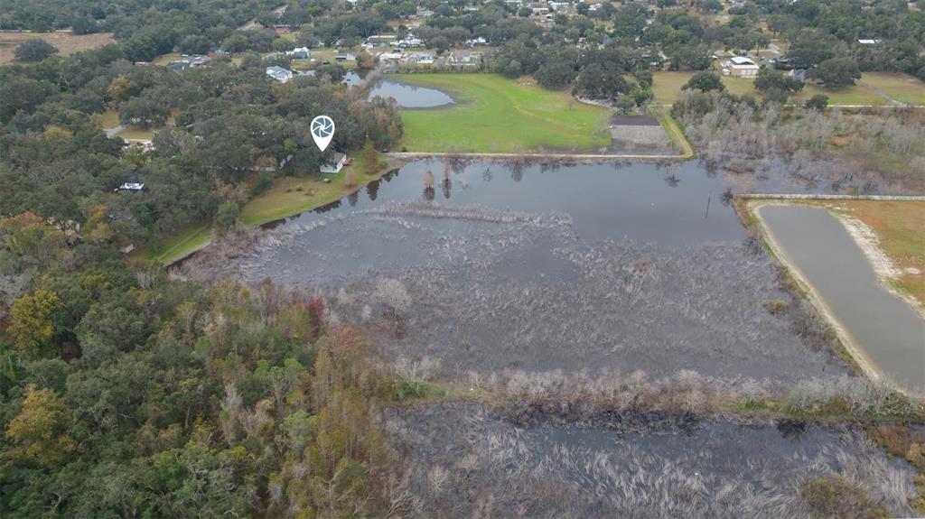 12628 Fort King Road Dade City, FL 33525 - Photo 52 of 59 a view of a house with a yard