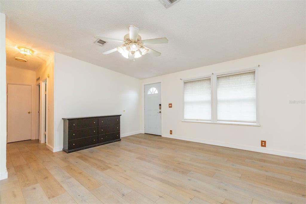 12628 Fort King Road Dade City, FL 33525 - Photo 6 of 59 an empty room with closet and windows