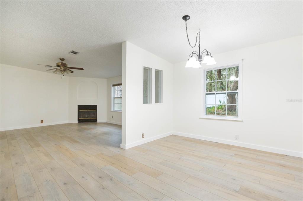 12628 Fort King Road Dade City, FL 33525 - Photo 9 of 59 wooden floor in an empty room with a window