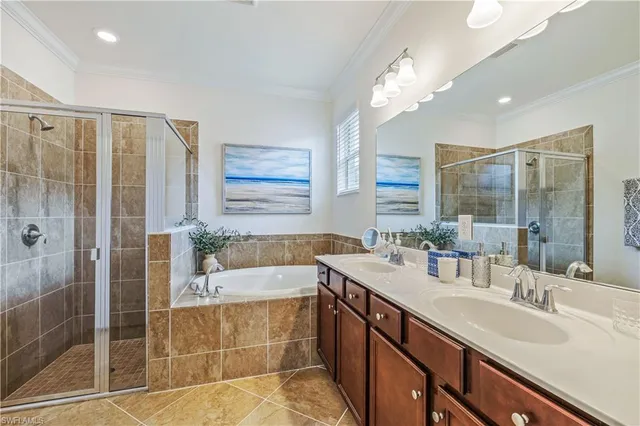 a bathroom with a double vanity sink a mirror and a shower