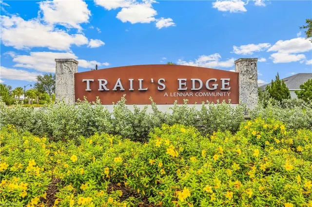 a sign that is sitting in front of a building