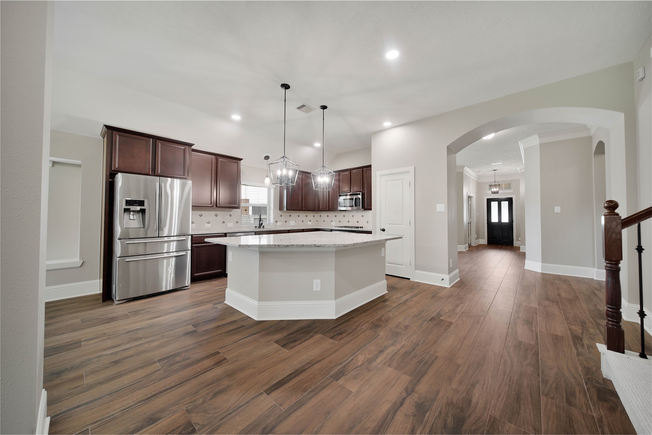1215 Jake Springs Court Spring, TX 77386 - Photo 6 of 49 What a kitchen! The huge granite island with wrap-around seating will be a favorite central gathering spot.