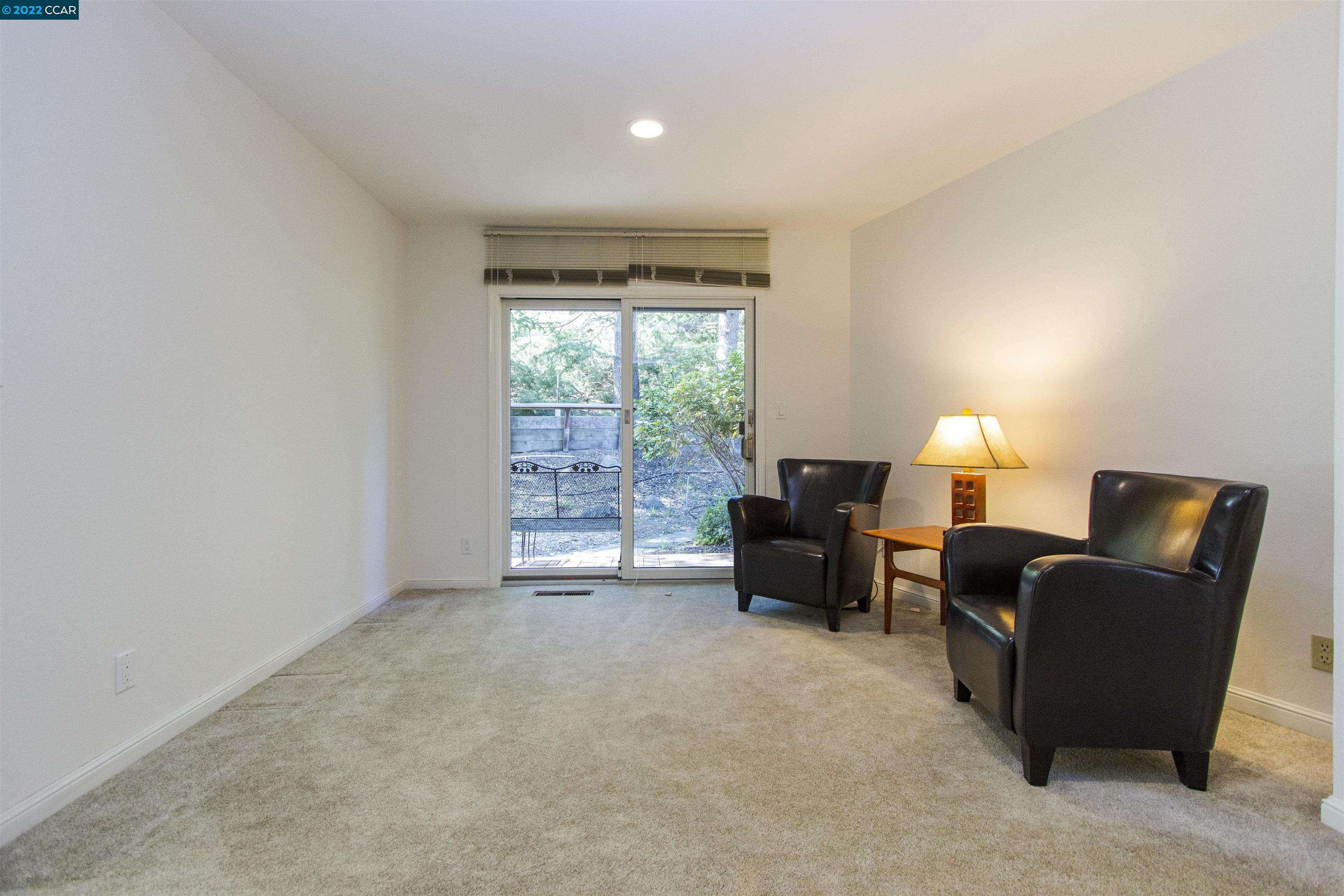 3399 Springhill Road Lafayette, CA 94549 - Photo 11 of 25 a living room with furniture and a flat screen tv