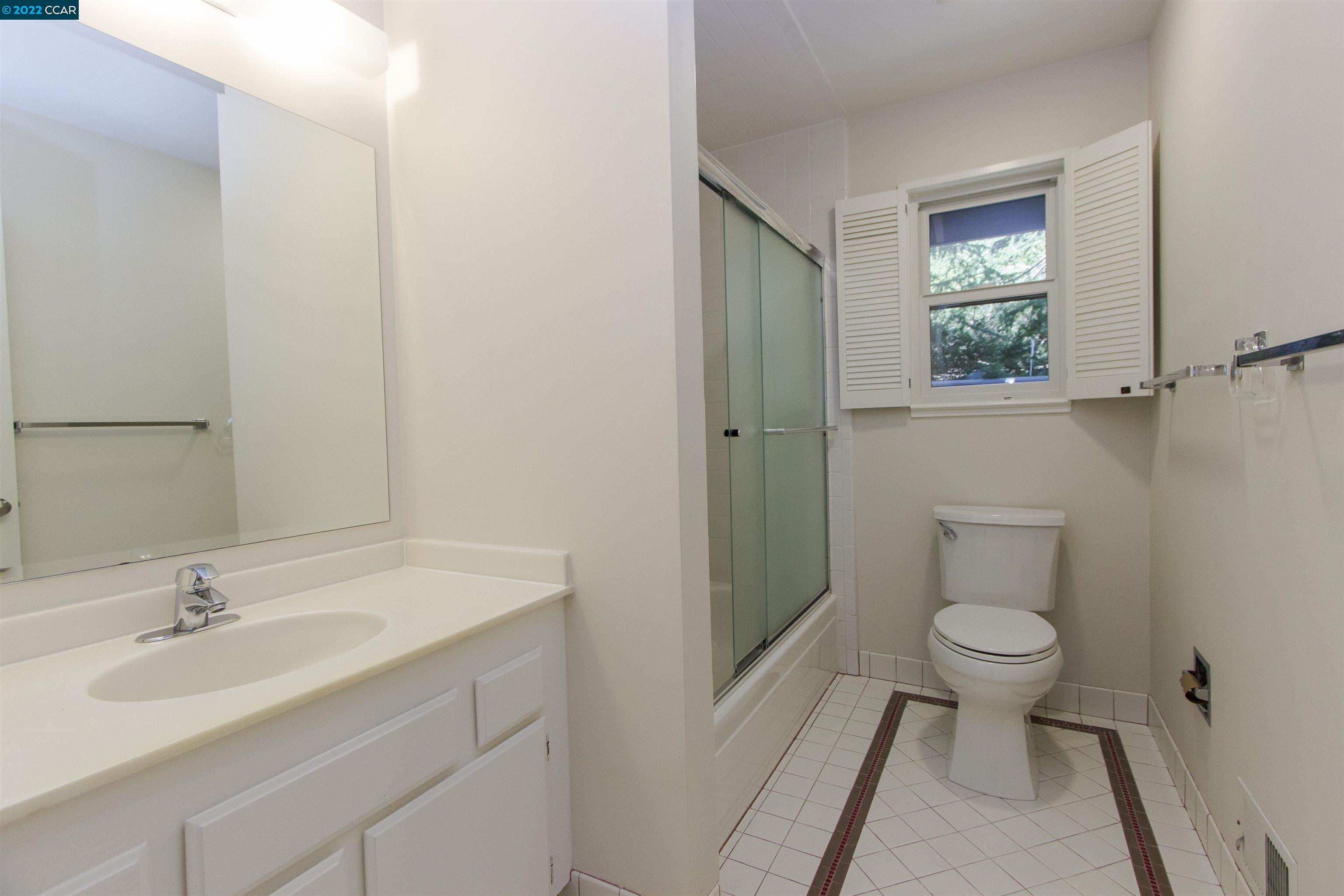 3399 Springhill Road Lafayette, CA 94549 - Photo 13 of 25 a bathroom with a sink toilet and a mirror