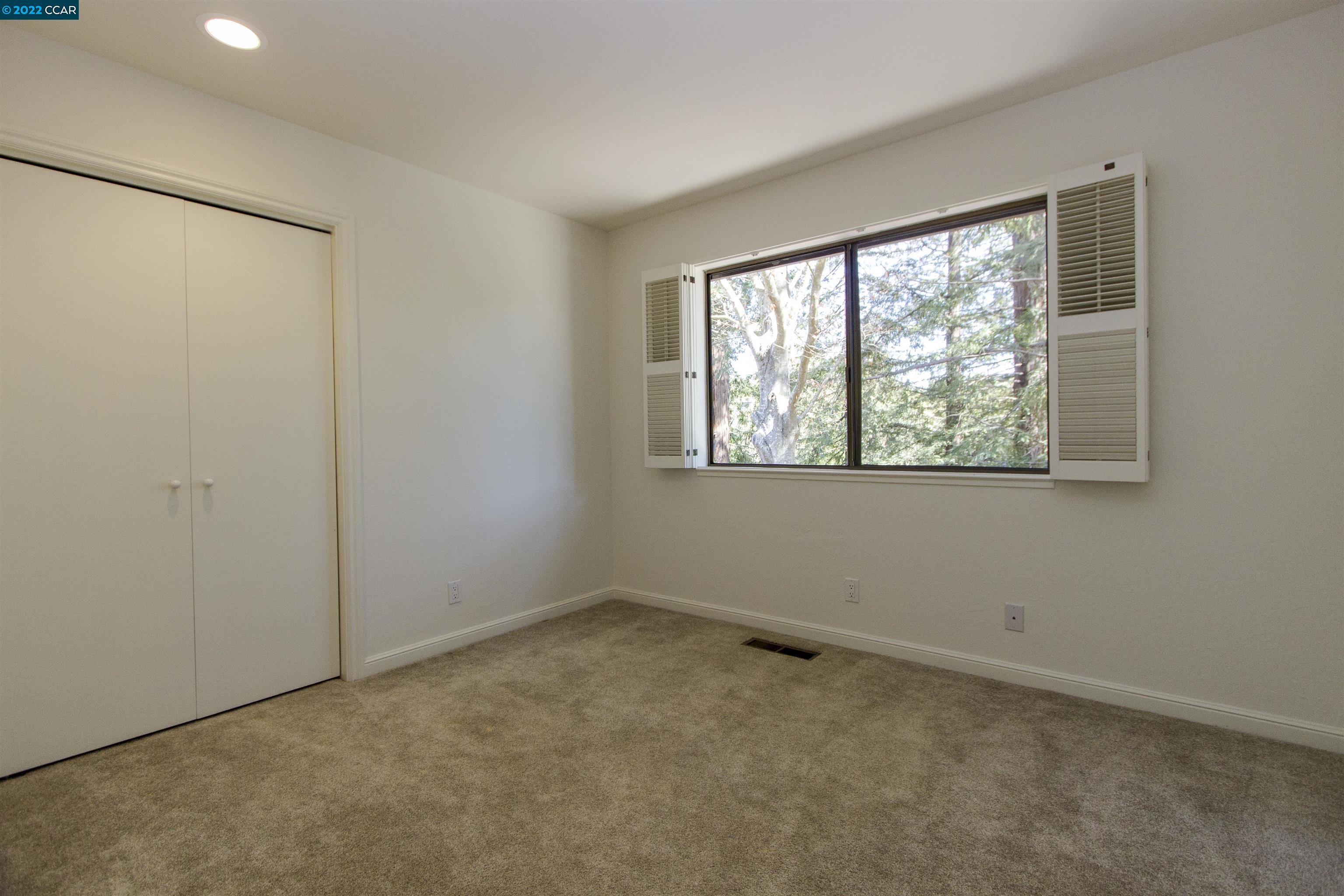 3399 Springhill Road Lafayette, CA 94549 - Photo 14 of 25 a view of an empty room with a window