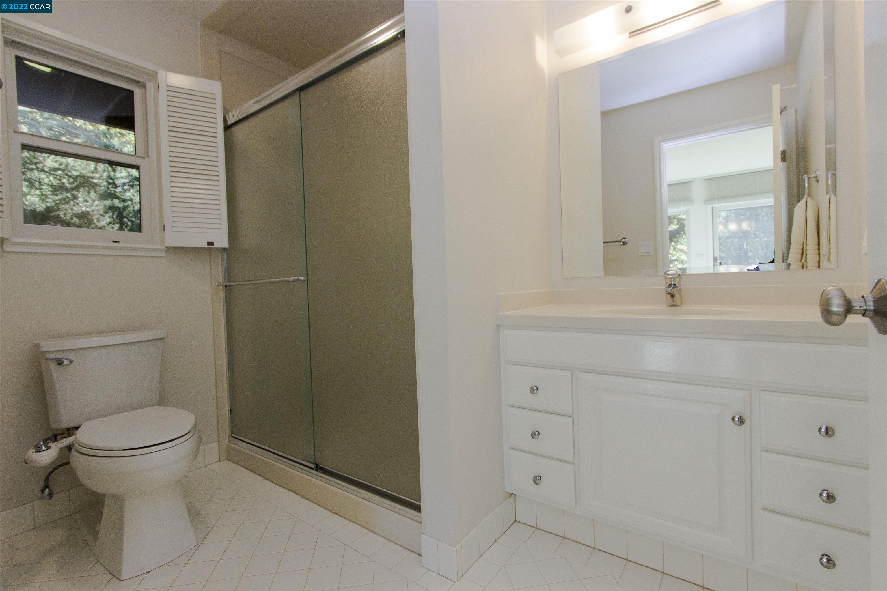 3399 Springhill Road Lafayette, CA 94549 - Photo 17 of 25 a bathroom with a sink toilet and shower