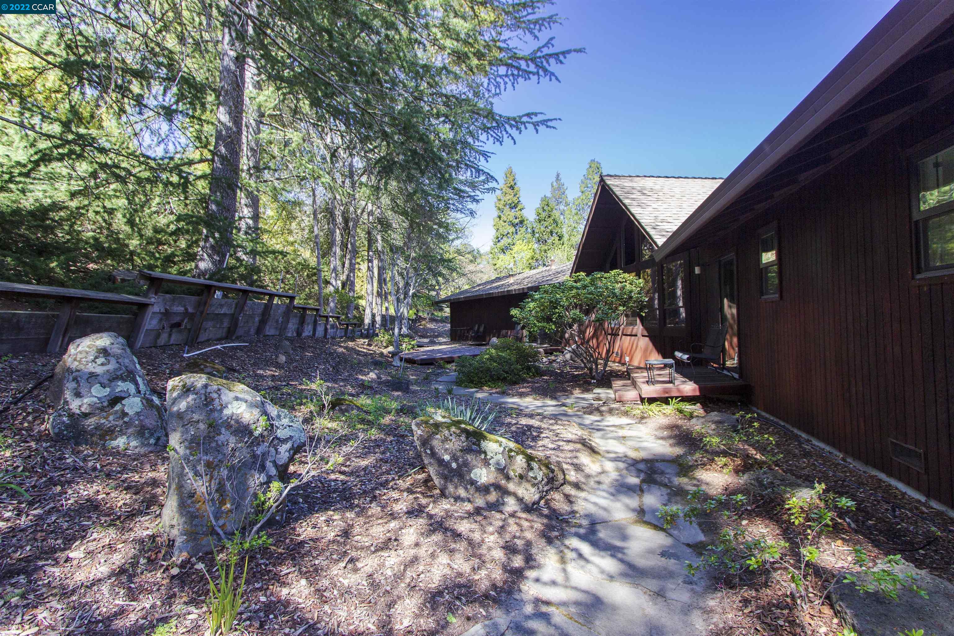 3399 Springhill Road Lafayette, CA 94549 - Photo 19 of 25 a view of a backyard with palm tree