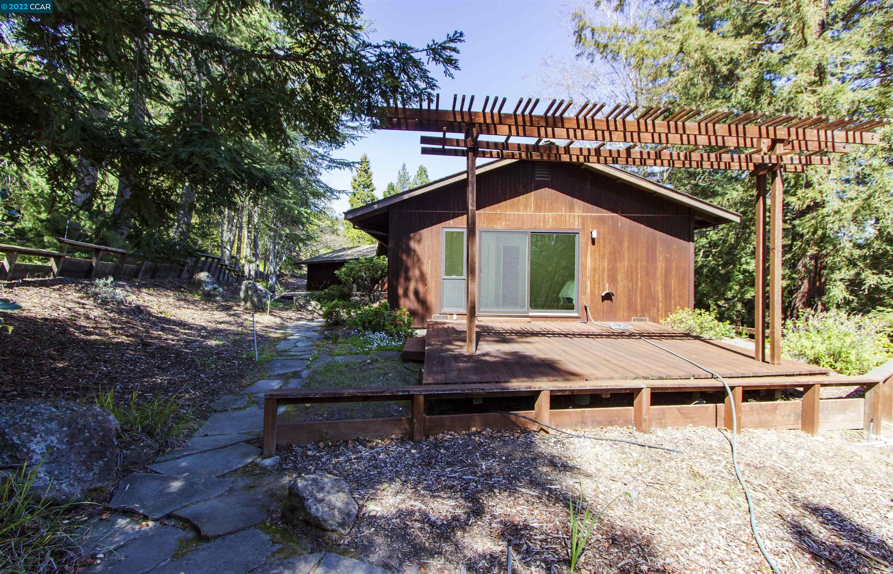 3399 Springhill Road Lafayette, CA 94549 - Photo 20 of 25 a front view of a house with garden