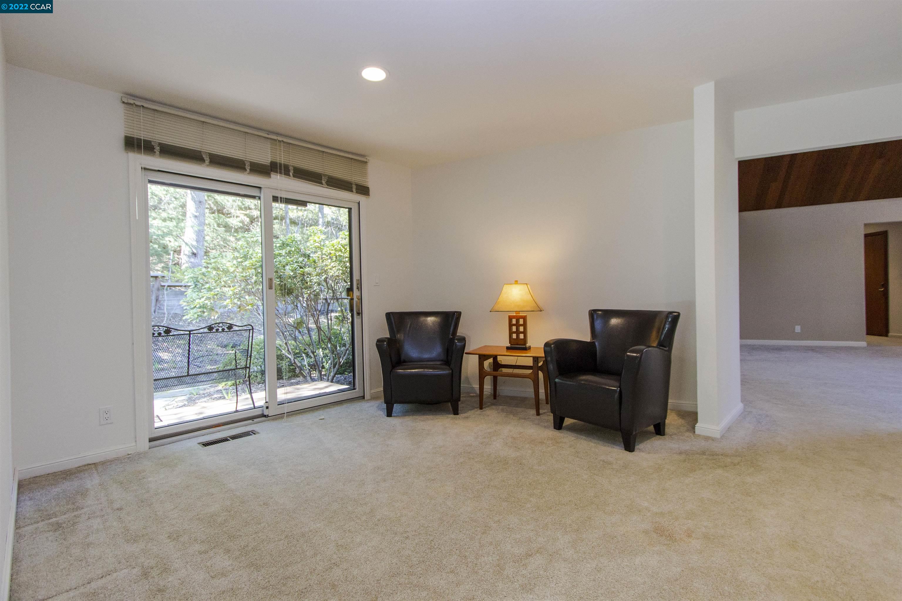 3399 Springhill Road Lafayette, CA 94549 - Photo 10 of 25 a living room with furniture and a fireplace