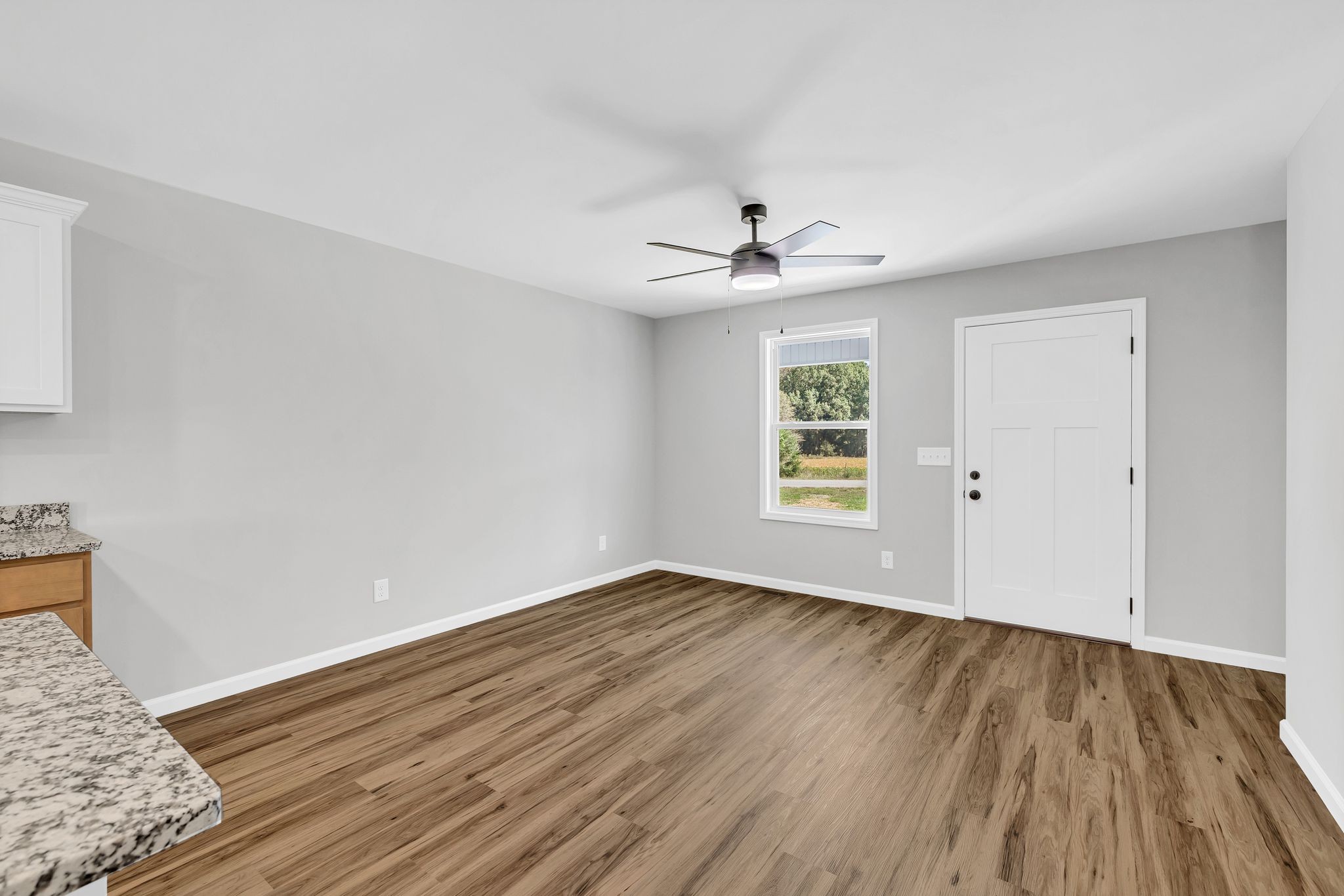 25 Glasner Lane Winchester, TN 37398 - Photo 11 of 32 a view of an empty room with wooden floor and a window