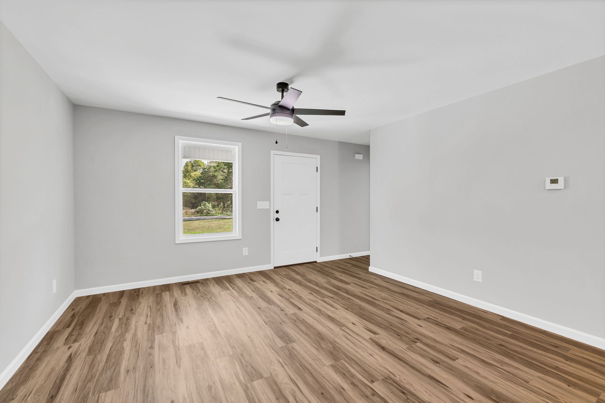 25 Glasner Lane Winchester, TN 37398 - Photo 12 of 32 wooden floor in an empty room with a window