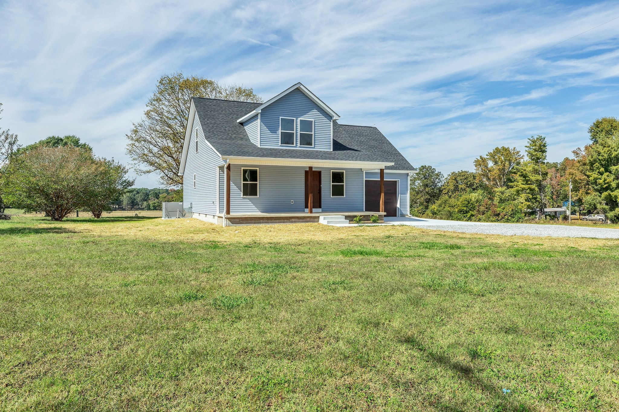 25 Glasner Lane Winchester, TN 37398 - Photo 3 of 32 a front view of a house with yard and green space