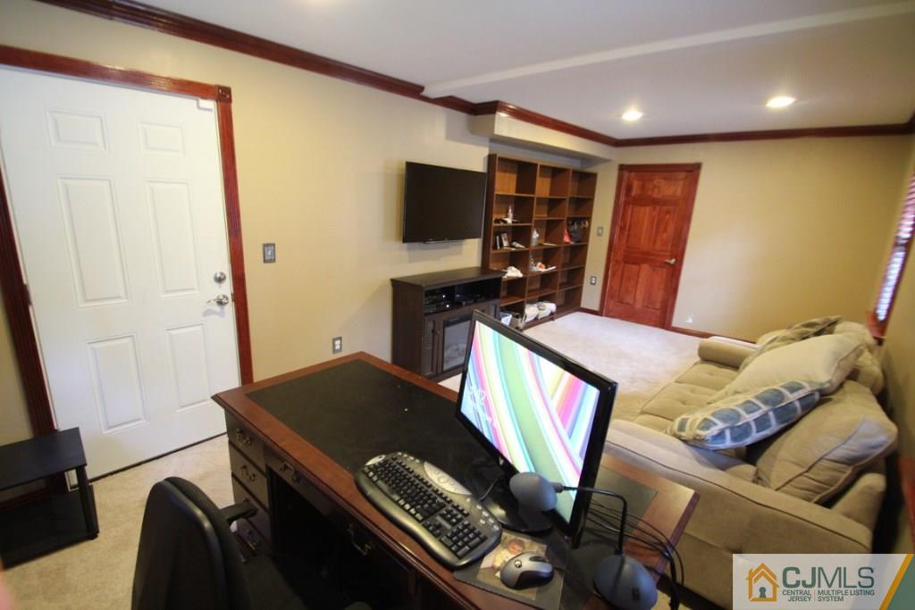 14 Nottingham Road Edison, NJ 08820 - Photo 14 of 19 a living room with furniture and a flat screen tv