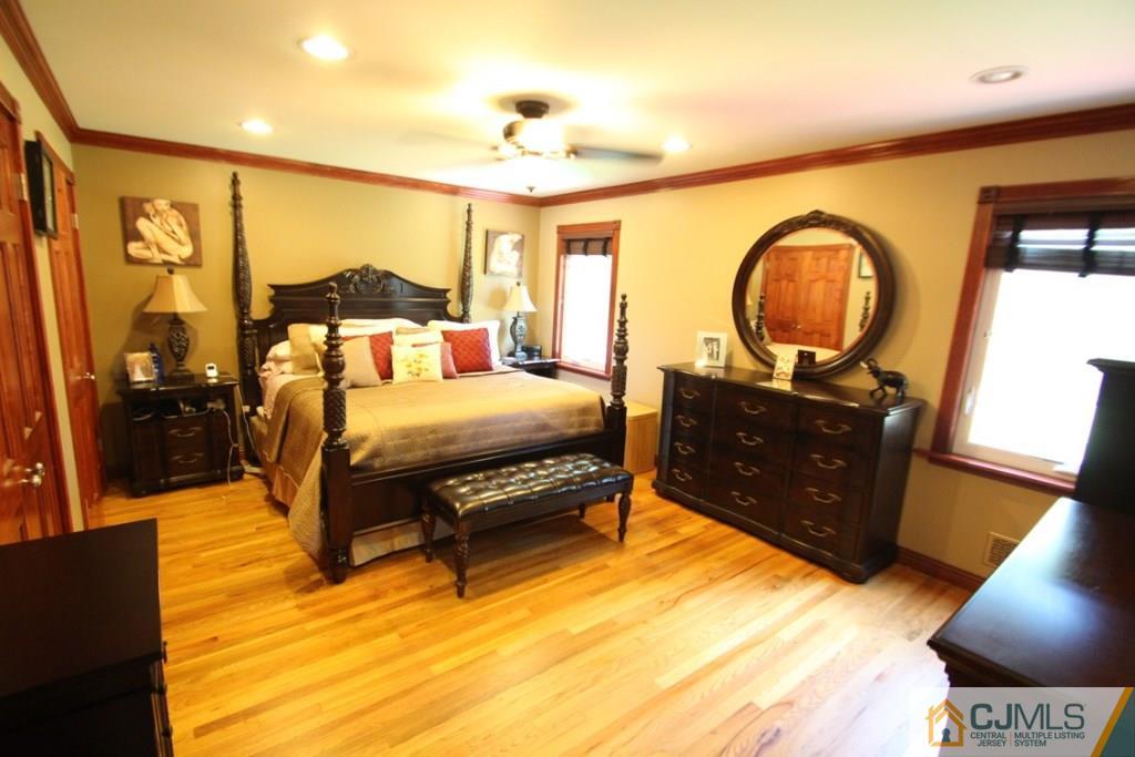 14 Nottingham Road Edison, NJ 08820 - Photo 8 of 19 a bedroom with a bed window and dresser