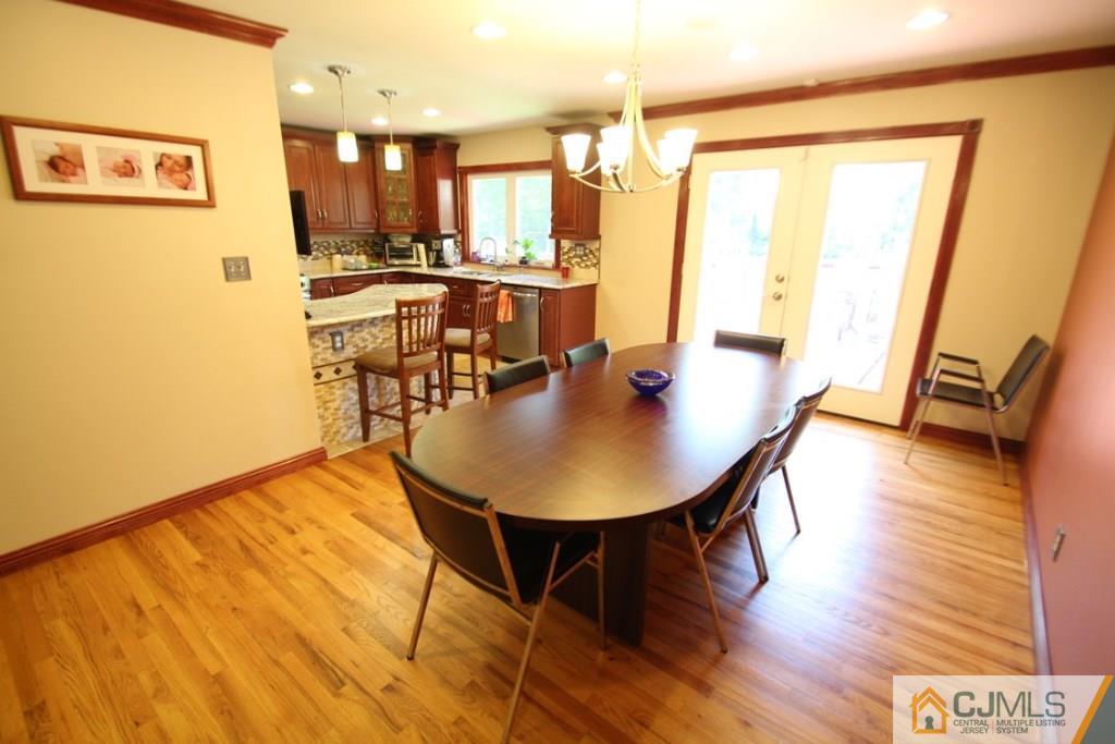 14 Nottingham Road Edison, NJ 08820 - Photo 9 of 19 a view of a dining room with furniture and wooden floor