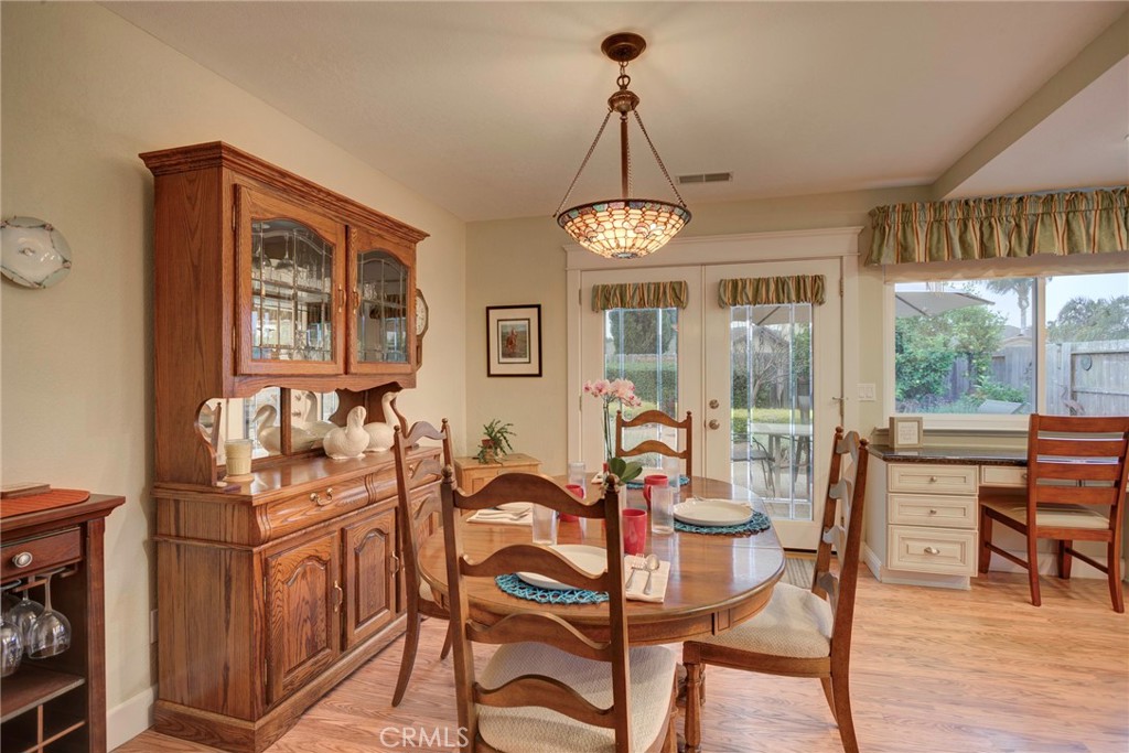 330 Stagecoach Road Arroyo Grande, CA 93420 - Photo 10 of 60 Bright dining area featuring ample natural light, a wooden buffet, and direct access to the backyard.