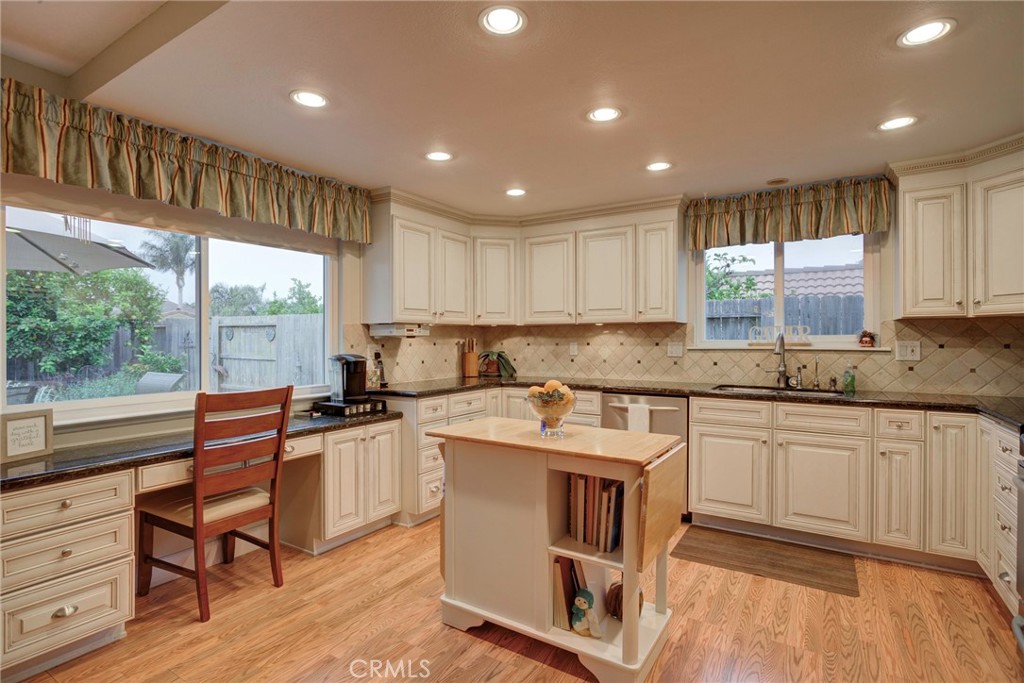 330 Stagecoach Road Arroyo Grande, CA 93420 - Photo 11 of 60 Bright and spacious kitchen featuring ample cabinets, a central island, and views of the backyard.