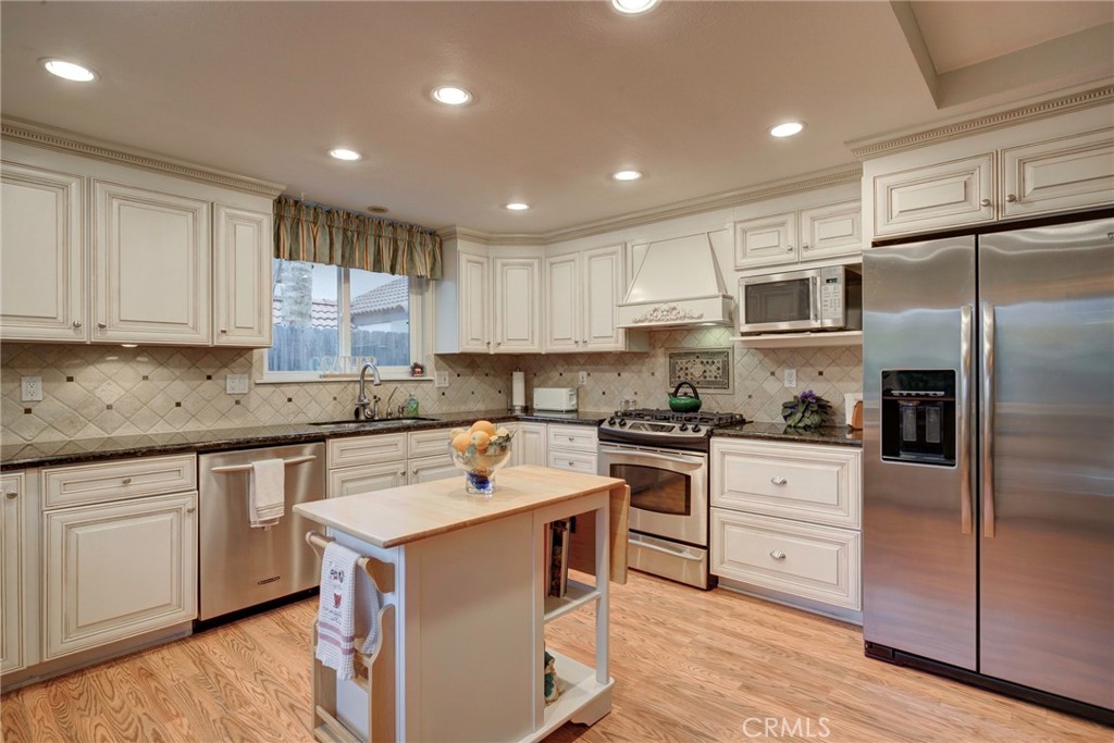 330 Stagecoach Road Arroyo Grande, CA 93420 - Photo 13 of 60 Bright and functional kitchen featuring modern appliances, ample storage, and a central island perfect for gatherings.