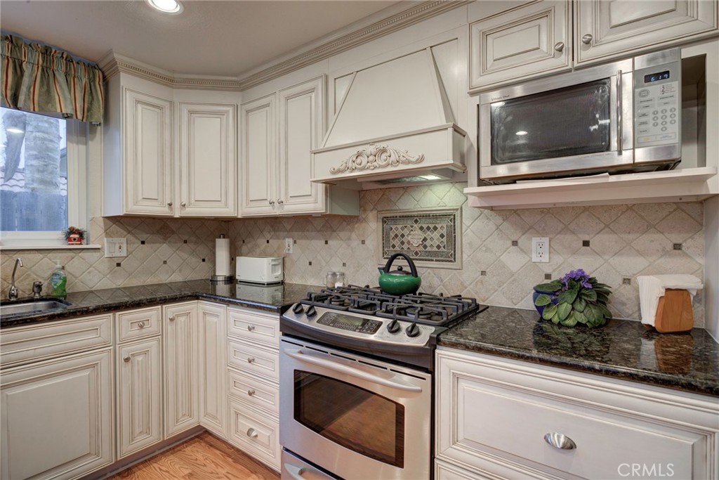 330 Stagecoach Road Arroyo Grande, CA 93420 - Photo 14 of 60 Well-appointed kitchen featuring modern appliances, custom cabinetry, and a functional layout for culinary enthusiasts.