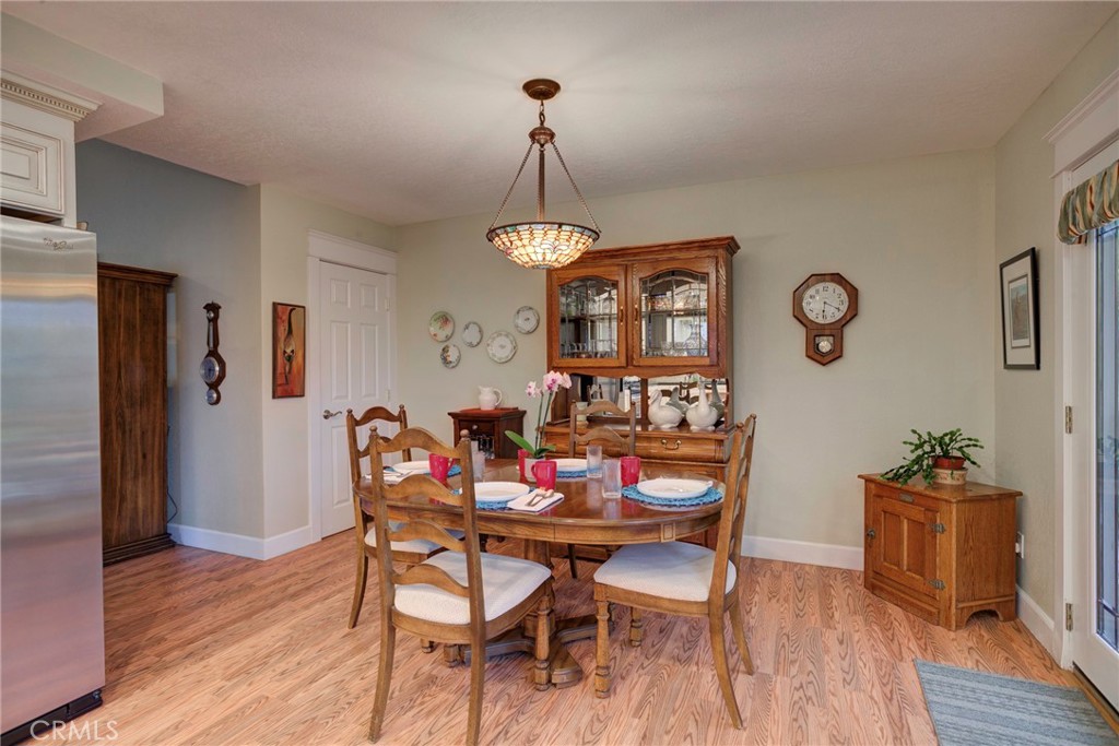 330 Stagecoach Road Arroyo Grande, CA 93420 - Photo 18 of 60 Bright and inviting dining area with rich wood accents, perfect for family gatherings and entertaining.