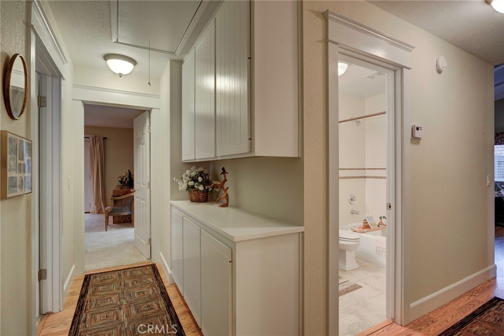 330 Stagecoach Road Arroyo Grande, CA 93420 - Photo 20 of 60 Bright and inviting hallway leads to spacious primary suite and a well-appointed bathroom.