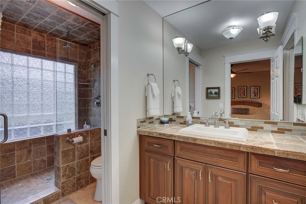 330 Stagecoach Road Arroyo Grande, CA 93420 - Photo 25 of 60 Spacious bathroom featuring a glass shower, double vanity, and modern fixtures for a refreshing experience.