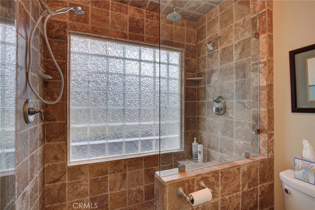 330 Stagecoach Road Arroyo Grande, CA 93420 - Photo 26 of 60 Modern bathroom featuring a spacious walk-in shower with glass block windows , three showerheads, built-in shower bench and stylish tile finishes.