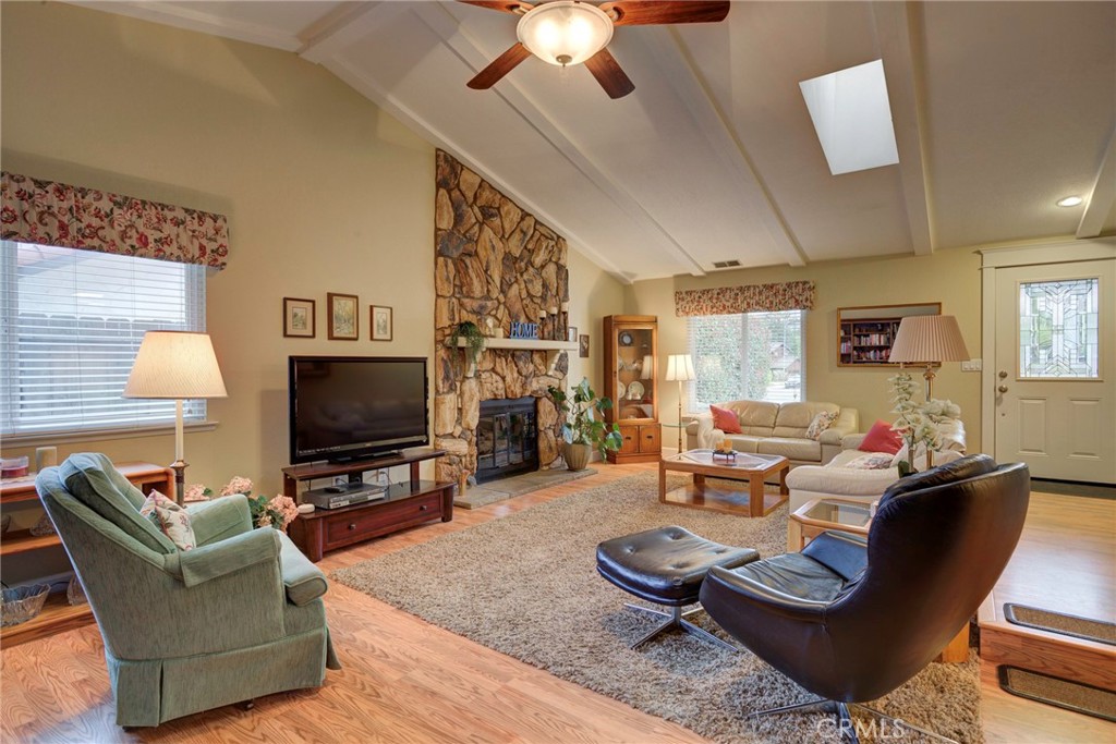 330 Stagecoach Road Arroyo Grande, CA 93420 - Photo 7 of 60 Spacious living area features a stunning stone fireplace, perfect for gatherings and comfortable relaxation.